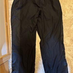 Under Armour Black Track Pants with Elastic Waistband and Relaxed Fit